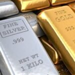 Break on record rise in gold and silver prices