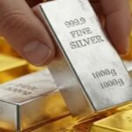 Gold and silver fall after record rise