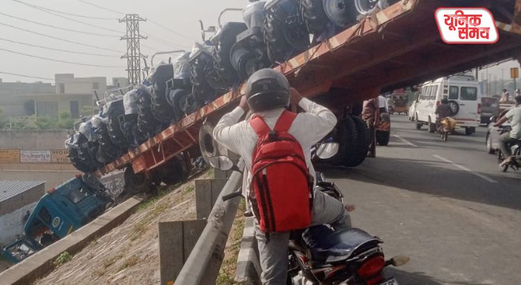 Trolley Loaded with Tractors Crashes Through Bridge Railing and Hangs Suspended in Mid-Air