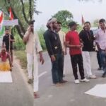A young man from Barsana has set out on a Dandvat Yatra while holding a sugarcane stalk