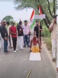 A young man from Barsana has set out on a Dandvat Yatra while holding a sugarcane stalk